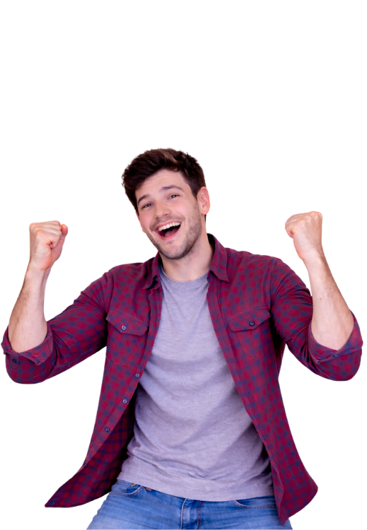 Smiling man in plaid shirt raises both fists in celebration.